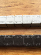 27 LBS BLACK WHEEL WEIGHTS-1/4 OZ -27 LBS GREY- 1/4 OZ. STICK-ON ADHESIVE TAPE