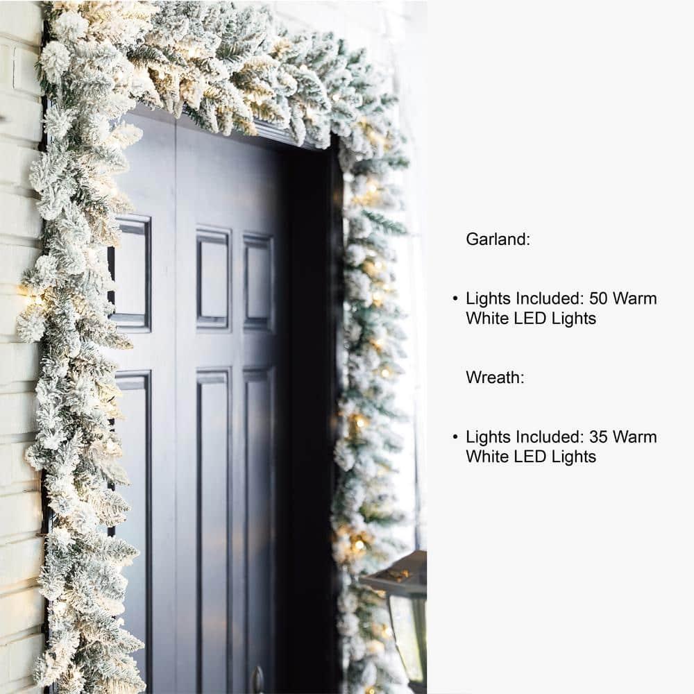 2-Pack 9 ft. Pre-lit LED Artificial Christmas Garland and 24 in. D Pre-lit Snow Flocked Christmas Wreath Set
