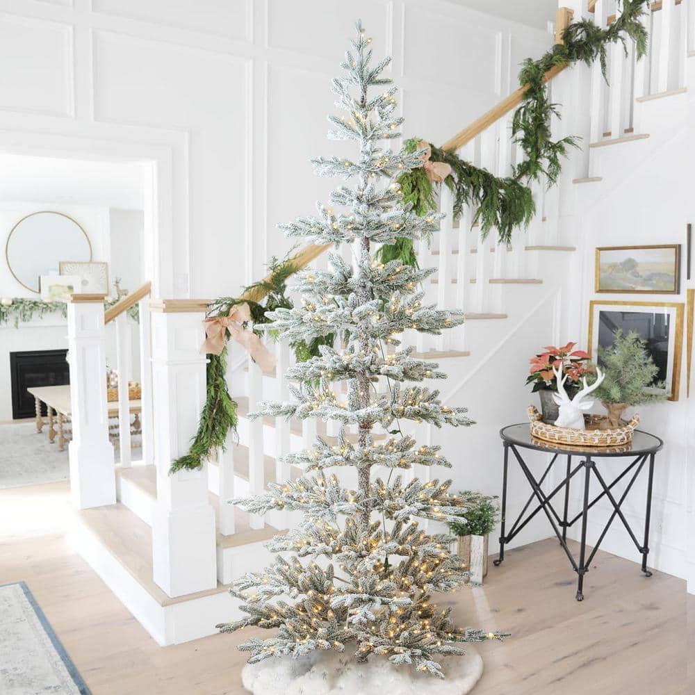 9 ft. Deluxe Pre-Lit Flocked Pine Artificial Christmas Tree with 650 Warm White Lights