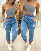 solid color drawstring elasticized waist ripped jeans