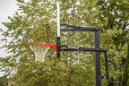 Silverback 54" In-Ground Height-Adjustable Basketball System with Tempered Glass Backboard, Anchor Mounting, and 5-year Limited Warranty