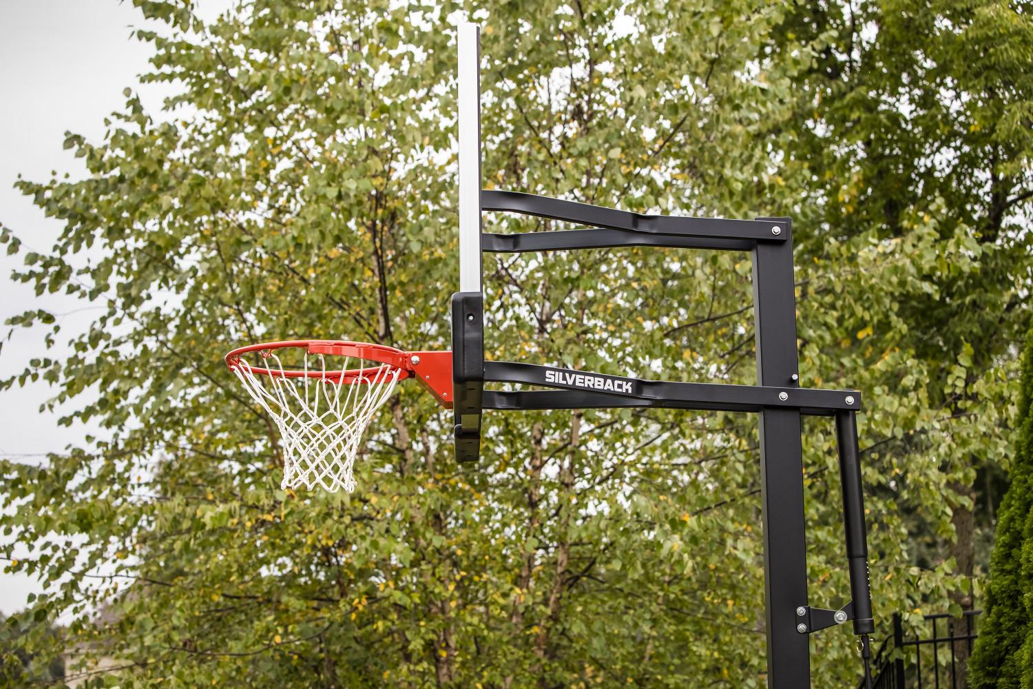 Silverback 54" In-Ground Height-Adjustable Basketball System with Tempered Glass Backboard, Anchor Mounting, and 5-year Limited Warranty