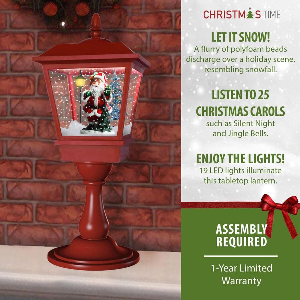 25 in. Christmas Tabletop Musical Snowy Lantern with Sant Scene, Cascading Snow and Christmas Carols