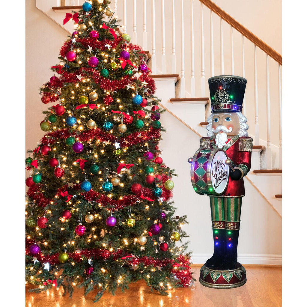 Fraser Hill Farm Indoor/Outdoor Oversized Christmas Decor, 6-Ft. Nutcracker Playing Bass Drum w/ Moving Hands, Music, Timer, and 32 LED Lights
