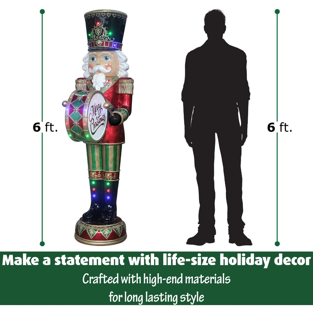 Fraser Hill Farm Indoor/Outdoor Oversized Christmas Decor, 6-Ft. Nutcracker Playing Bass Drum w/ Moving Hands, Music, Timer, and 32 LED Lights